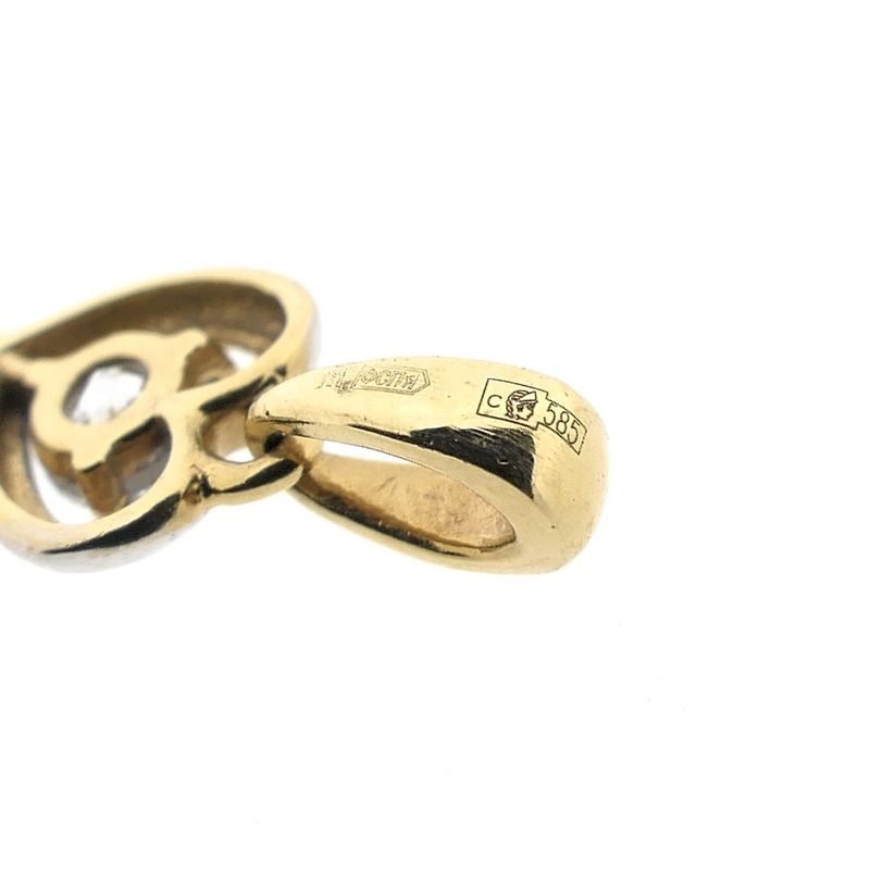 Image 8 of Two-tone gold pendant of a key with zirconia