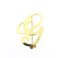Gold letter brooch; letter G