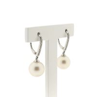 White gold stud earrings with pearl and diamond | 0.03 ct.