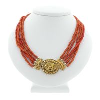 Antique necklace with blood coral and gold cap bell.