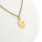 Image 8 of Gold pendant of a girl's child's head