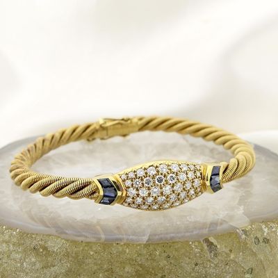 Image 2 of 18-karat gold twisted bracelet with sapphire and diamond; 1.11 ct. | Wellendorff