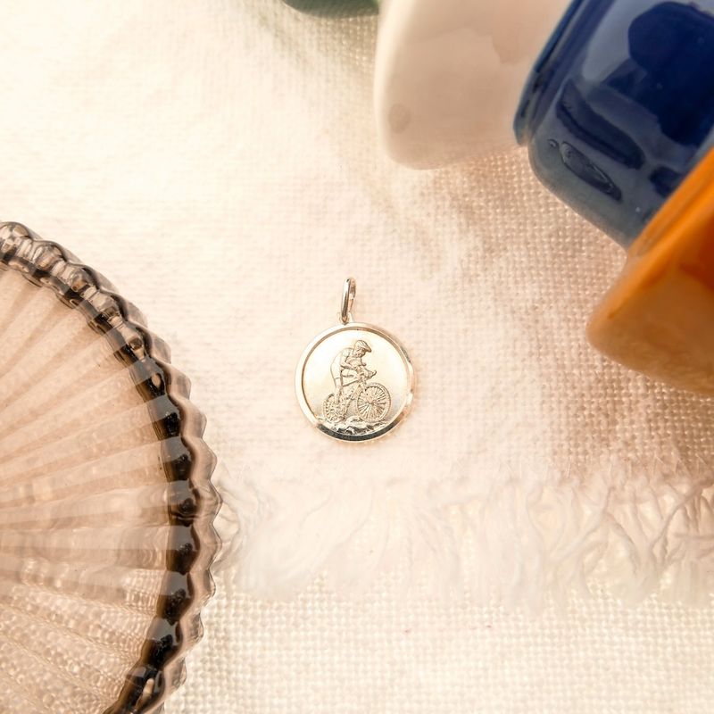 Image 7 of Silver pendant of a man on a racing bike