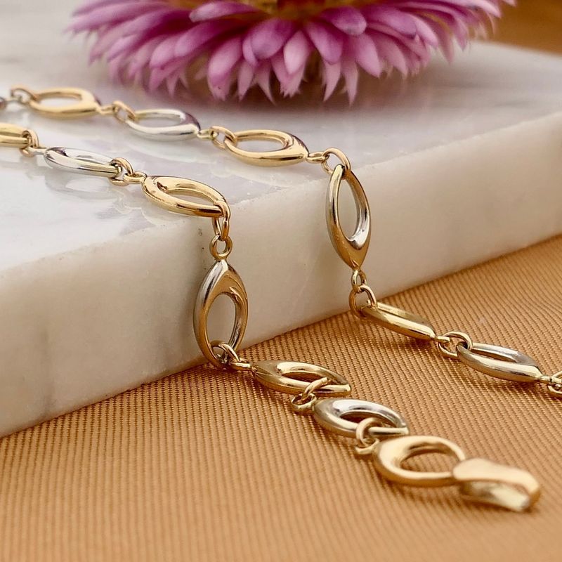 Afbeelding 2 van Bicolor gouden fantasie schakelarmband | 19 cm