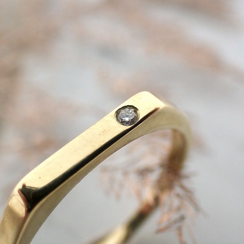 Image 3 of Subtle gold ring with 0.015 ct diamond.