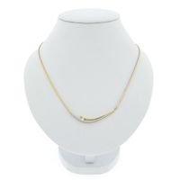Two-tone gold cobra link necklace with a fixed pendant and diamond