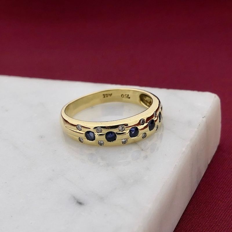 Image 2 of Gold ring with sapphire and diamond; 0.12 ct.