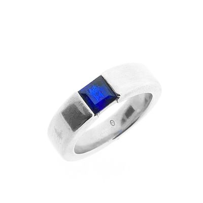 Image 1 of Silver ring with synthetic sapphire.