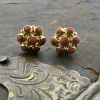 Gold stud earrings with red coral