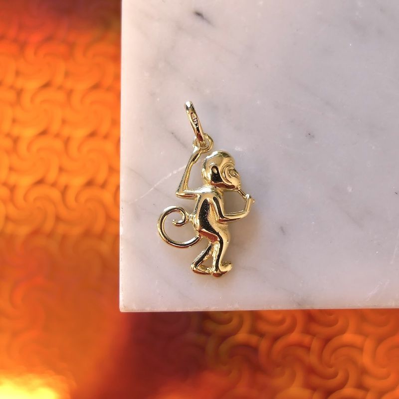 Image 2 of Gold pendant of a monkey with banana