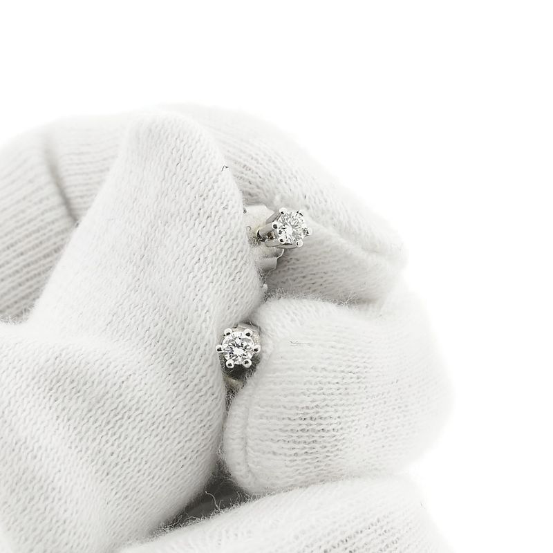 Image 7 of White gold solitaire stud earrings with 0.12 ct diamond.