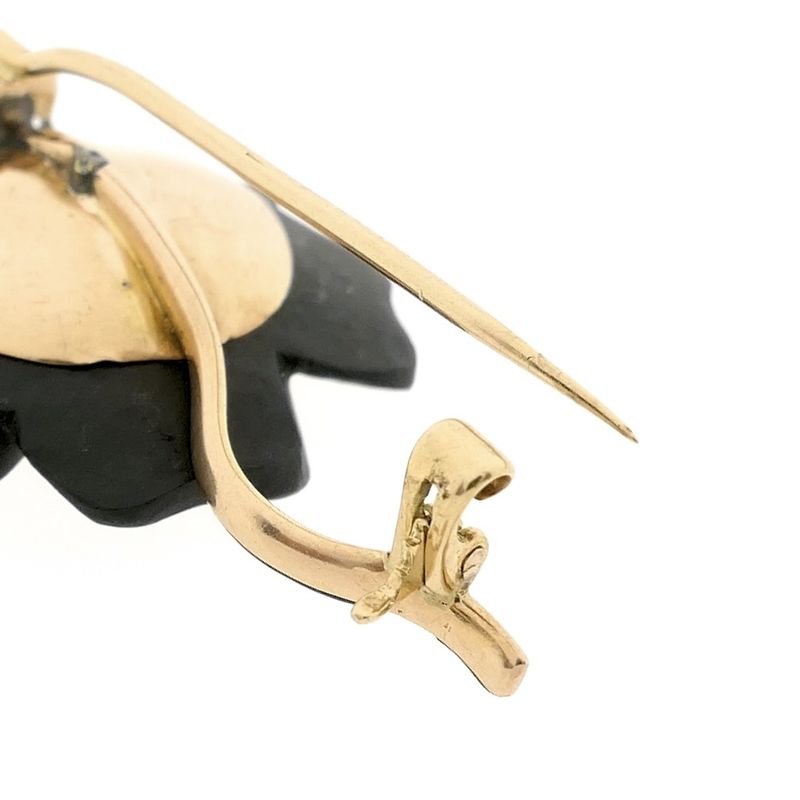 Image 5 of Gold flower brooch with onyx and diamond | 0.60 ct.