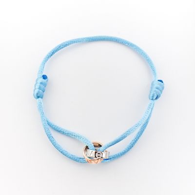 Image 1 of Bracelet made of light blue satin cord with two-tone gold rings; Løve