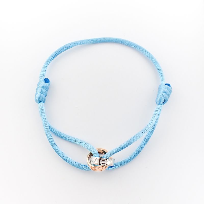 Image 1 of Bracelet made of light blue satin cord with two-tone gold rings; Løve