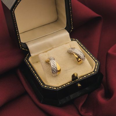 Bicolor gold stud earrings with diamond | 0.02 ct. Image 2 of Bicolor gold stud earrings with diamond | 0.02 ct.