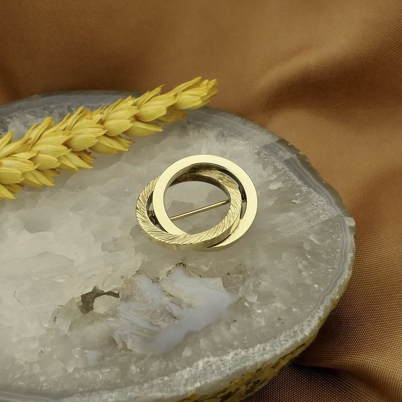 Image 2 of Golden dynamic brooch