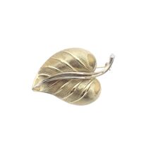 Two-tone gold brooch of a leaf