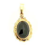 Vintage gold pendant with garnet stone