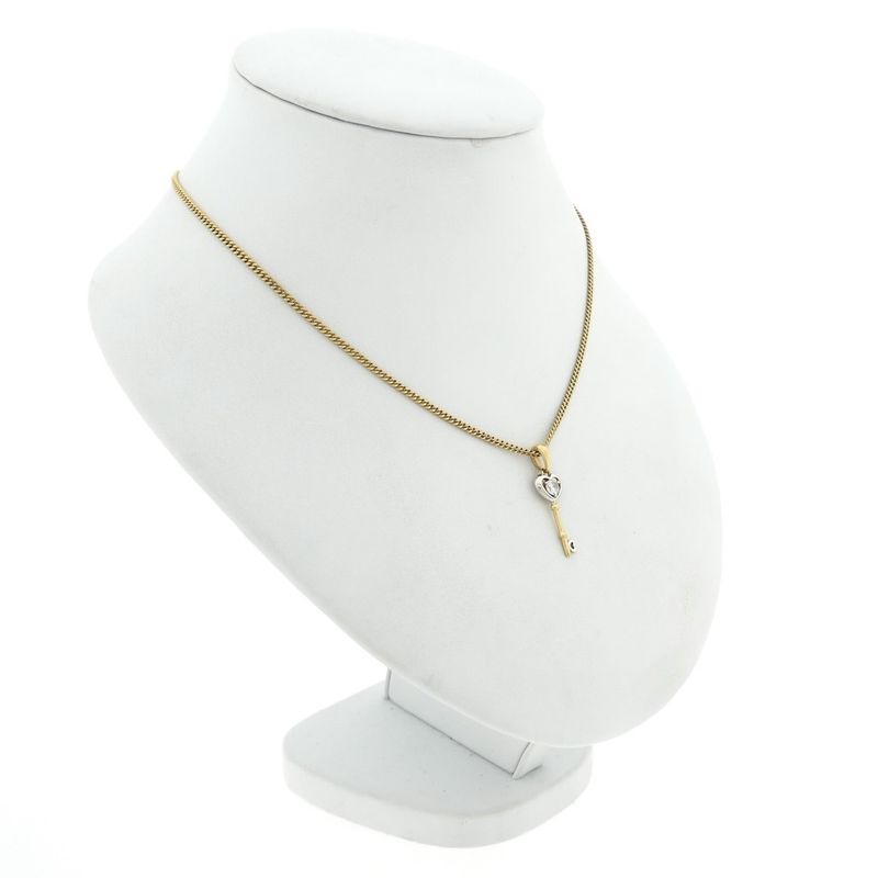 Image 5 of Two-tone gold pendant of a key with zirconia