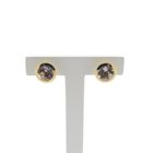 Image 1 of Gold stud earrings with lilac colored zirconia