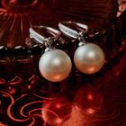 Image 2 of White gold stud earrings with pearl and diamond | 0.03 ct.
