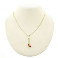 Gold S-link necklace with blood coral