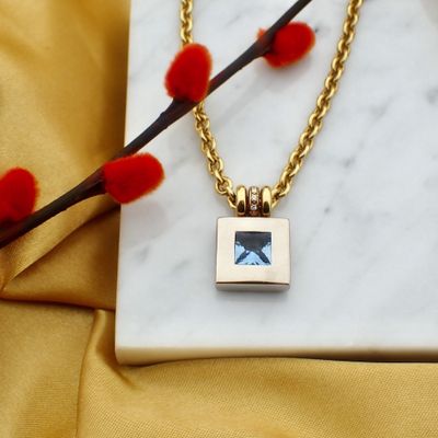 Image 2 of Two-tone gold necklace with topaz and diamond; 0.06 ct.