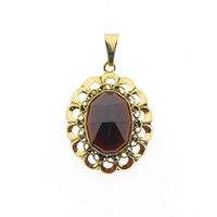 Vintage gold pendant with garnet