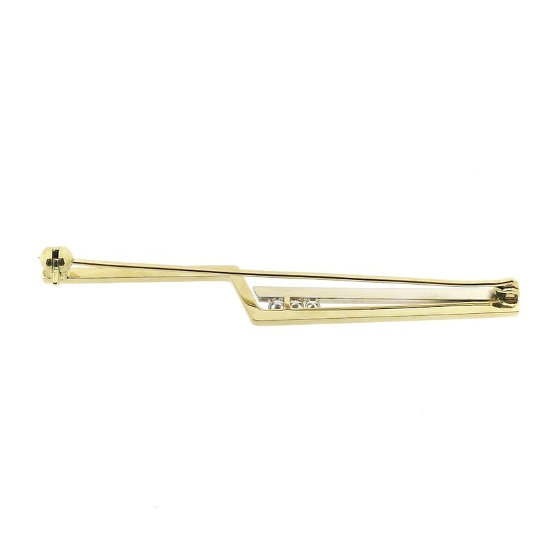 Image 10 of Two-tone gold long narrow brooch with diamonds; 0.15 ct.
