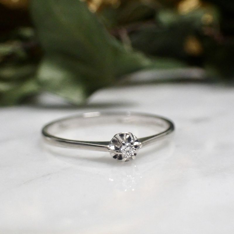 Image 2 of White gold solitaire ring with 0.03 ct diamond.