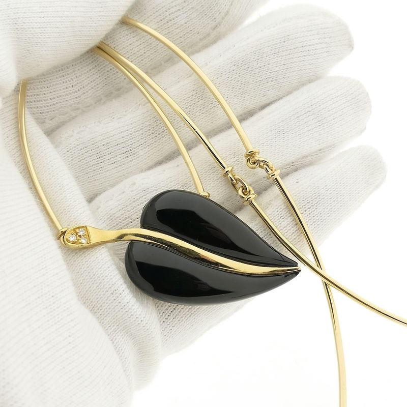 Image 11 of Gold necklace with onyx and diamonds; 0.03 ct.