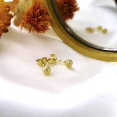 Gold stud earrings with diamond-cut button Image 2 of Gold stud earrings with diamond-cut button
