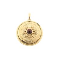 Gold pendant with garnet