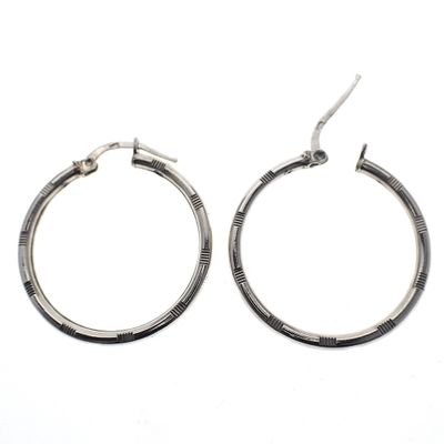 Image 2 of Silver earrings with a ribbed pattern | Ø 30 mm