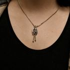 Image 11 of Two-tone gold necklace with fixed pendant and diamonds; 0.09 ct.