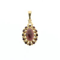 Vintage gold pendant with garnet