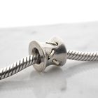 Image 2 of Pandora charm; Silver with gold; Stitches