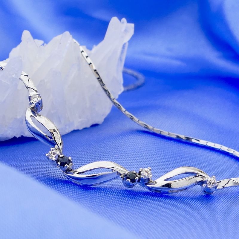 Image 2 of White gold necklace with fixed pendant of sapphires and diamonds; 0.14 ct.