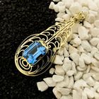 Image 2 of Gold pendant with light blue tourmaline.