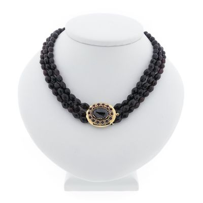 Antique garnet bead necklace with gold decorative clasp. Image 1 of Antique garnet bead necklace with gold decorative clasp.