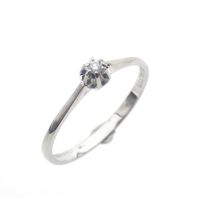 White gold solitaire ring with 0.03 ct diamond.