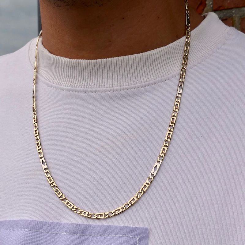 Afbeelding 9 van Gouden valkenoog schakelketting met witgouden wiebertjes