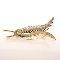 Gold brooch with two feathers