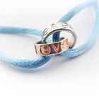 Image 3 of Bracelet made of light blue satin cord with two-tone gold rings; Løve