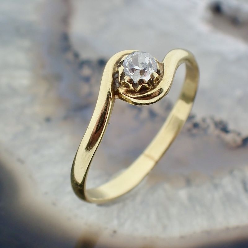 Image 2 of Golden subtle ring with diamond 0.13 ct.