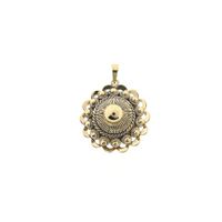Antique gold pendant of a Zeeland button.