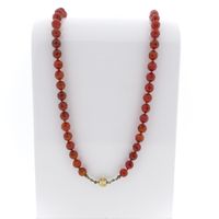 Carnelian bead necklace with gold clasp.