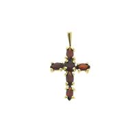 Gold cross pendant with garnet stones