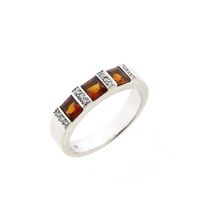 White gold ring with orange tourmaline and diamonds; 0.12 ct.