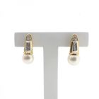 Image 1 of 18 carat gold stud earrings with cultured pearl and 0.18 ct diamond.